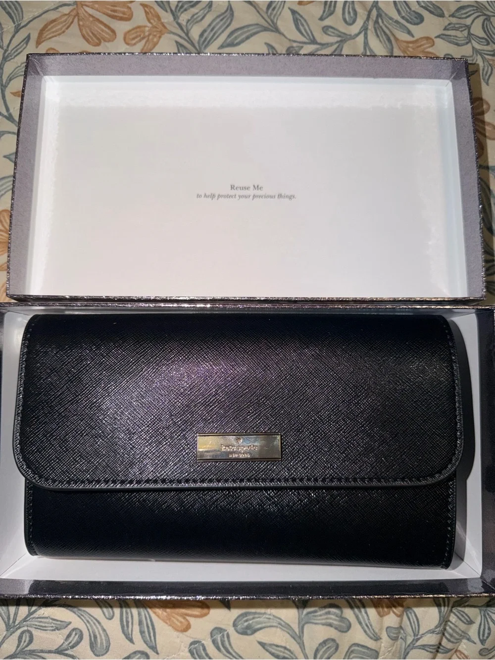 kate spade black saffiano leather flap wallet with gold plaque